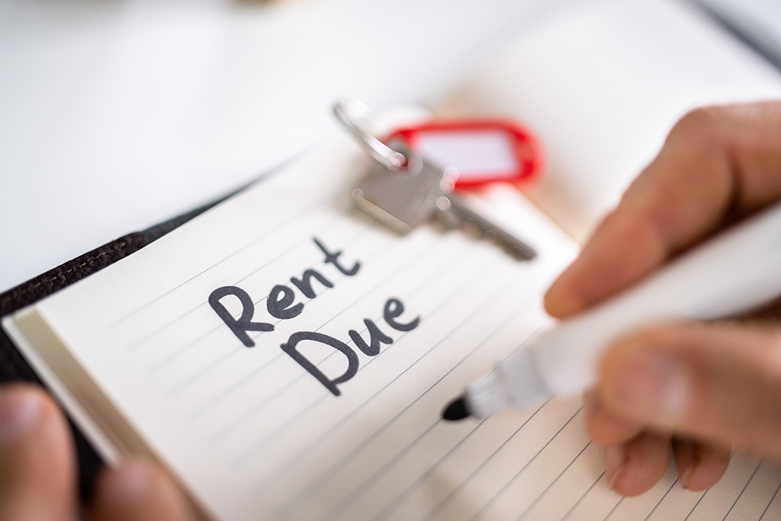 Photo of notepad with Rent Due written on it