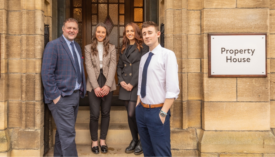 Photo of staff members outside the office